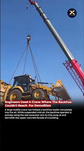 Engineers Lift a Backhoe with a Crane for High-Reach Demolition