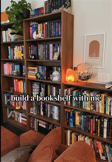 chaotically building my new bookshelf reorganizing my library the night before a flight? more likely than you’d think! 📚 🔨IKEA Billy Bookcase in Walnut #bookshelforganization #homelibrary #bookcommunity #tbrpile #ikeatok