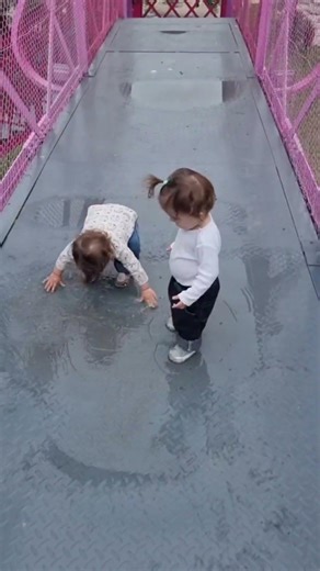 Twin girls playing in puddles 💦 | cutest moment