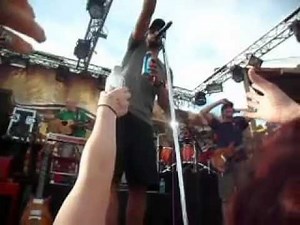 Luke Bryan having fun throwing beers to the crowd & dancing