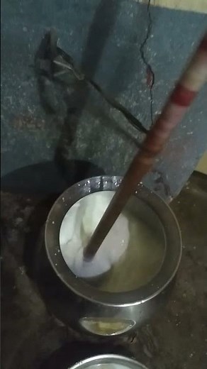 Traditional way of churning curd to buttermilk