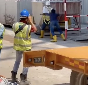 Video of construction workers fighting goes viral, others onsite just watched as man gets punched in the head - Singapore News