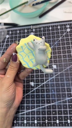 Atelier by Hima on Instagram: "Clay Cat - adding details Can I go back to making anything else but cats from clay any sooner? No 🥺 If you have cat(s) in your home, you would know how weird but comfortable positions they sleep in. And that was the idea behind this clay cat magnet. I made two different clay pieces - clay cat bed and sleepy clay cat - both have magnets in the body so it can comfortably sit on the fridge or any other magnetic surface. I used air drying clay and gave enough time to 