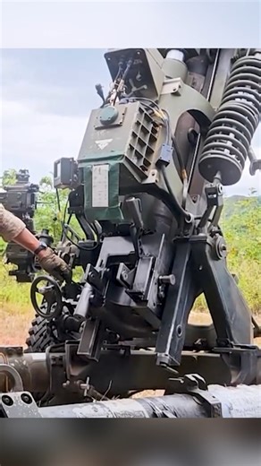 U.S Army Prepare and firing M119 howitzer