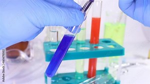 Video of a first person view laboratory inspection with test tubes & medical glass equipment.