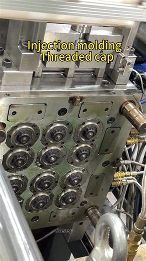 12-cavity threaded cap injection mold in production. Built with automatic thread unscrewing mechanism, 12 parts per shot for stable & high-volume output. Custom tooling for cap components. #InjectionMold #CustomTooling #ThreadedCapMold #MoldMaking #PlasticInjection