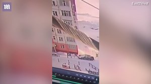 Woman in Russia walks away after fall from building