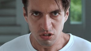 Emotional stress. Aggressive man portrait, brutal male person looking in camera. Aggressive man experiences emotional stress, looks at camera with anger and start screaming. Outburst of anger and rage