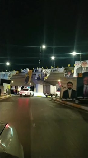 Nighttime Traffic Under an Illuminated Bridge