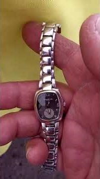 Review of a KENNETH COLE watch with a gray dial, silver hands, and a second hand at 6 o'clock, WR...