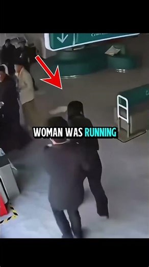 A Woman Helps an Elderly Man During an Earthquake