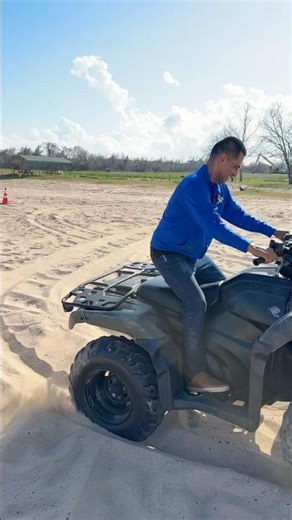 Houston dad getting ATV out of slushy sand