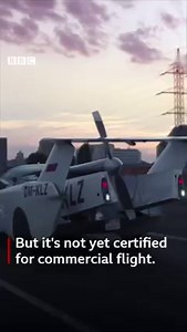 The hybrid car-aircraft, AirCar, is equipped with a BMW engine and runs on regular petrol-pump fuel. Its creator, Prof Stefan Klein, said it could fly about 1,000km (600 miles), at a height of 8,200ft (2,500m), and had clocked up 40 hours in the air so far. https://bbc.in/3qHoTCC | BBC News India