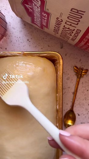 Honey Butter Bread is fluffy, soft, buttery, and slightly sweet. The top bakes up beautifully golden brown. No special loaf pan required! This recipe yields two loaves. REMINDER save this recipe for easy access 🔖 * 4 - 5 1/2 cups Arrowhead Mills All Purpose Flour (or bread flour) *2 cups warm water *1 tbsp active yeast *1/4 cup honey *2 tsp salt *2 tbsp vegetable or canola oil Honey Butter: *2 tsp honey *3 tbsp butter melted Instructions *In a cup add yeast, water and a tsp of honey. Allow to r