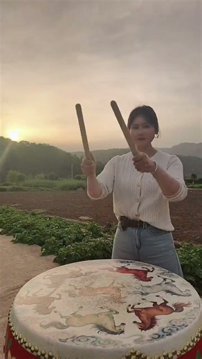 Watch her destroy this traditional Chinese drum.#drums #drumming