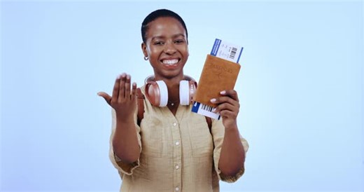 Woman, passport and plane ticket in studio for travel, hand or welcome with smile on face by blue