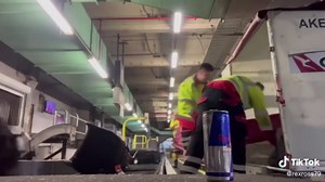 Laughing baggage handlers caught slamming bags at airport