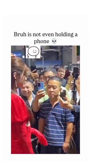 fuuukey | The Instagram reel features a short video from an auto show where a crowd films a woman in a red dress entering a car, but one man stares... | Instagram