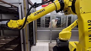 ROMIAS is revolutionizing bakery automation with FANUC's M-20iA/35M and M-710iC/70 robots. These cutting-edge solutions are designed to handle bakery trays and relieve workers from heavy, repetitive tasks. Our system efficiently loads dough into pans and manages both full and empty hot bakery trays. Discover how our advanced automation solutions can transform your bakery operations! #BakeryAutomation #Robotics #IndustrialAutomation | FANUC Europe