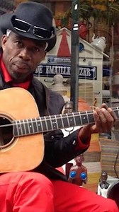 Brushy One String on Instagram: "While touring in Amsterdam, Brushy sits down to play his new guitar, donated by Duncan Africa."
