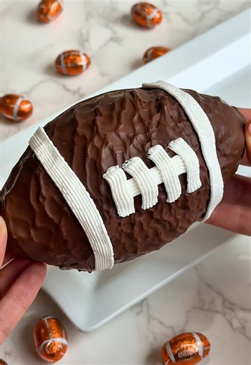 Touchdown treats, anyone? 🏈 See’s Rocky Road Football is packed with creamy milk chocolate, honey marshmallow, and walnuts 🤤 Drop a 🏈 if you’re in! #sweettreat #football #footballlover #seescandies