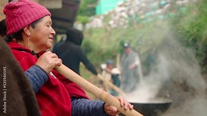 peasant woman cooking with wooden spoon