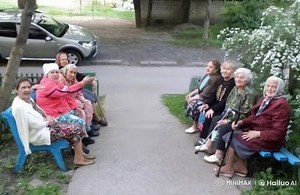Elderly Women Delight in Children’s Play at the Park