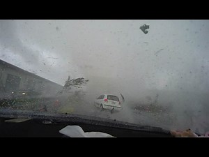 Tornado lifts car.