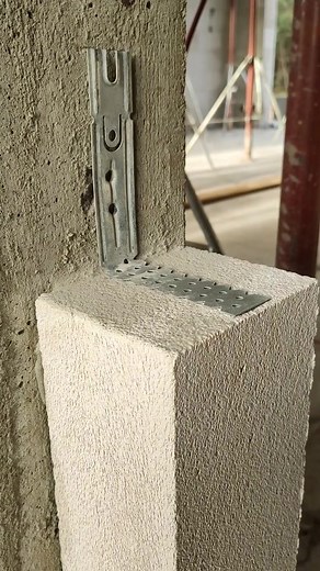 Metal Bracket Installation by Construction Worker