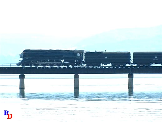Southern Pacific 4449 is sporting a dark grey and black paint scheme and is at Sandpoint, Idaho on a BNSF employee appreciation special in 2000. From the Machines of Iron show "4449 Journey” & “4449 Nightlight" https://rfd.video/4449Journey | Steam Giants