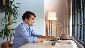 Man Typing Work on Keyboard of Laptop Computer in Home Office Close-Up. Entrepreneur Talks Online with Internet Connection on Wireless Network Device. Discussion of Business Success on Room Background