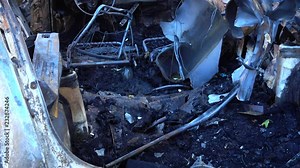 The blown-up car as a result of terrorist attack. Car after terrorist attack.