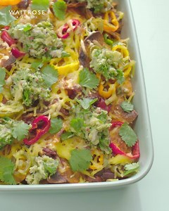 Vegan chilli jackfruit nachos, topped with Romano peppers and hot jalapeños. Serve with homemade guacamole and sprinkle with fresh coriander. | Waitrose & Partners