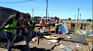 WATCH: The anti-land invasion unit in Cape Town demolishes wood-and-iron structures at the Joe Slovo informal settlement in Langa.18 families have been resisting to vacate the area to allow the Human Settlements Department to build about 130 low-cost houses on the land. This is part of the N2 Gateway housing project. | SABC News Western Cape