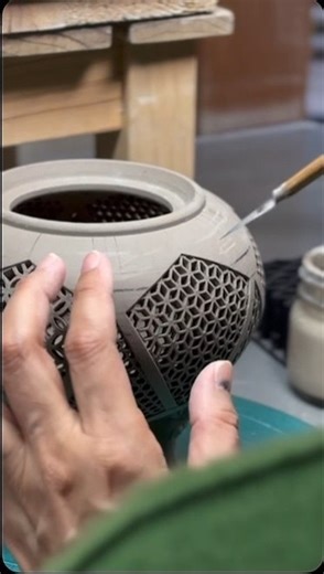 Satsuma ware is a type of pottery from present-day Kagoshima Prefecture, one variety of which is White Satsuma, known for its ivory-coloured body, fine painting and lavish appearance. Here, a skilful craftsperson carves into the clay to form delicate patterns across an incense holder. Reminiscent of bamboo basketry, this technique was developed in the late 1870s by the 12th-generation potter Chin Jukan. The family’s kiln has been active for over four centuries in Kagoshima and has played a signi