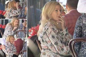Ellie Goulding lets her hair down and enjoys rare day off from healthy routine