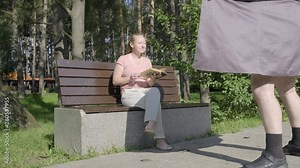 Male exhibitionist in park. pervert opens his coat in front of woman.