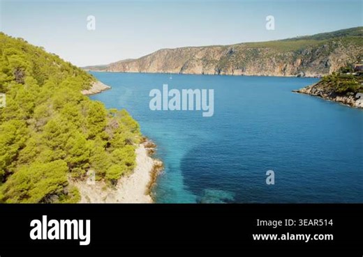 Mountain coastline view with lush forest and cliffs meeting the Ionian Sea in Kefalonia, Greece Stock Video Footage - Alamy