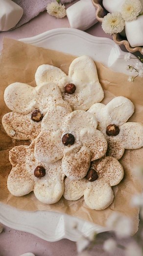 Yoko Segawa on Instagram: "Did you know you can make cookies out of marshmallows? These Marshmallow Flower Cookies require just two ingredients and are fun to make💕 Marshmallows are cut into a flower shape and baked into extra-crispy cookies with hazelnuts✨#holidaybaking #marshmallows Comment “Recipe” and I’ll send you a link to the recipe!💌 Or visit https://yokoskitchen.com/marshmallow-flower-cookies/ 💕"