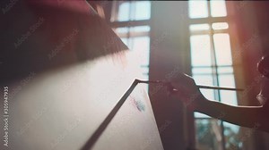 woman artist paint by window with brushes and oil dye