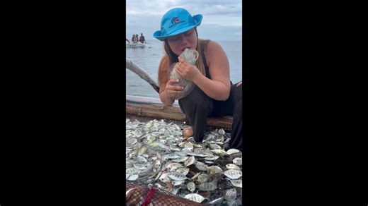 Cuttlefish squirts ink all over woman's face as she tries to eat it raw