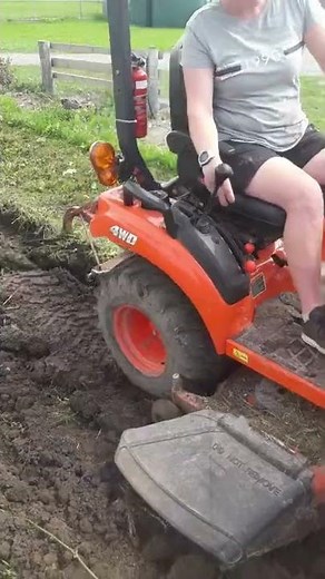 kubota bx2380 ploughing garden