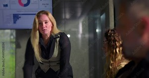 Female boss snapping man out of deep thought with loud reprimand during tense office meeting, assertive leadership and sudden confrontation in corporate environment