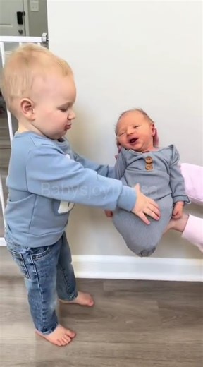 My 16 month old holding his new baby brother for the first time 🥹 Babys joyful usa 👶 #babysjoyfulusa