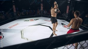 Two Skilled Mixed Martial Artists Clash in a Brutal Match, Combining Muay Thai, Boxing and Karate Techniques. Energy in the Crowded Arena Peaks as They Battle for Championship Victory