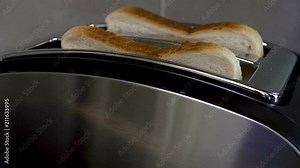 Toasts pop up out of toaster, fast breakfast, technologies in everyday life