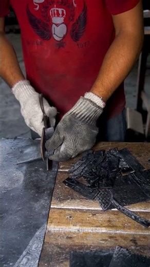 Worker Cutting Rubber Sheet Into Small Pieces