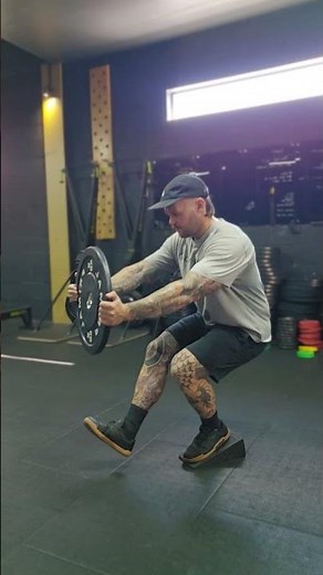 heel elevated weighted single leg squat