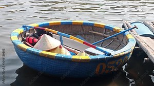 Traditional circular basket boats moored at bank in Hoi An Ancient Town, Vietnam