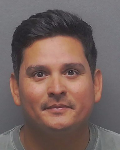 Judge says ex-Holy Cross coach accused of recording teen can be around children